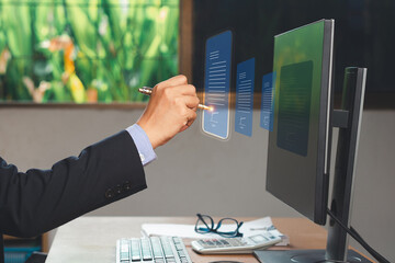Electronic signature. A businessman uses a pen to sign electronic documents on digital documents on...
