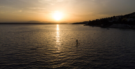 Alone sup board at the adriatic sea and sunset view. 