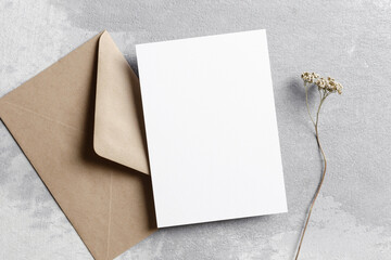 Wedding invitation card mockup with envelope and dry flower