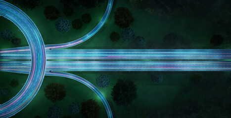 Aerial view of highway with car light trails at night