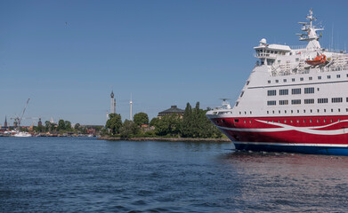 Fototapeta na wymiar Cruise ship arrives from the tour to Finland a sunny summer day in Stockholm 