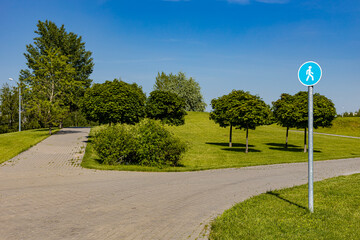  a sign in the park indicating a pedestrian zone