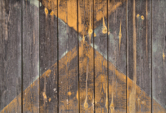 background old gray wood with shabby paint, with gaps between boards, knots. Weathered and faded natural wood with lines of boards, with space for text

