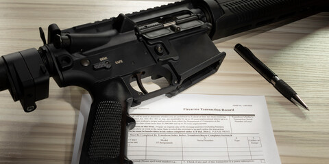 AR-15 and public domain 4473 purchase form the FBI requires someone to pass to take ownership of the gun - obrazy, fototapety, plakaty