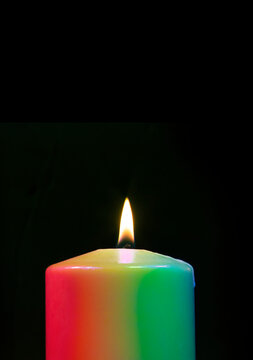 Candle with many colors burning