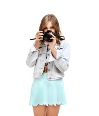 Shot of an funny young girl taking a photo with a  camera