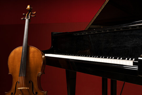Two classical instruments - the cello and the grand piano - on a stage waiting for their musicians before a recital