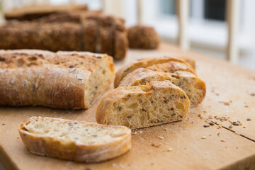 fresh loaf of bread on wooden board