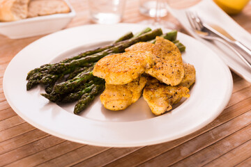 dietary meal rich in protein. Stir fried chicken breast and green asparagus