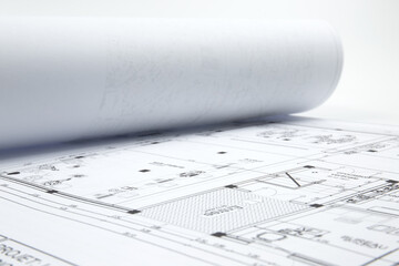 Architect rolls and architectural plan technical project drawing