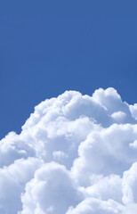 Naklejka na ściany i meble Stunning Fluffy White Cumulus Clouds on Vibrant Blue Sunny Sky