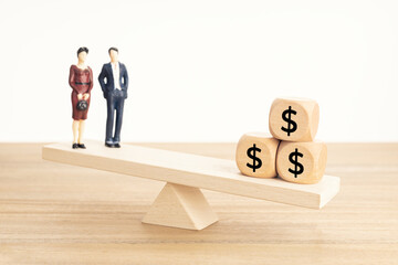 Life and Work or money balance concept. Couple figurine and dollar symbol on wooden blocks on...