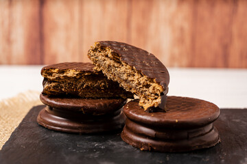 Classic argentinian chocolate alfajores filled with dulce de leche. Traditional food.