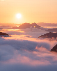 Obraz premium Sunrise above the clouds and mountains. Calming, relaxing, peaceful. 