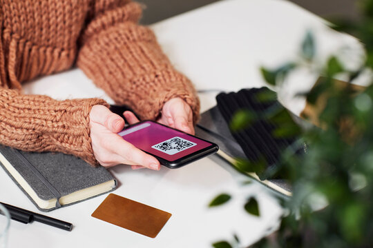 Woman's hands holding cell phone