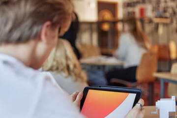 Student using tablet in class
