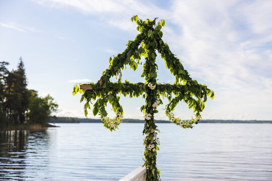 Midsummer maypole by lake