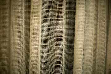 Curtains on window in evening. Fabric covers window.