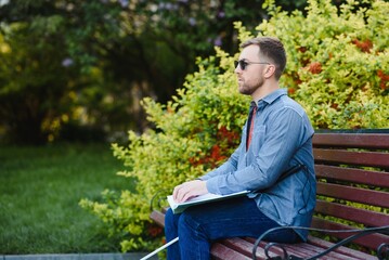Blinded man reading by touching braille book
