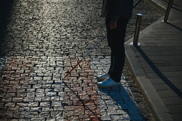 Close-up Of A Blind Man Standing With White Stick On Street