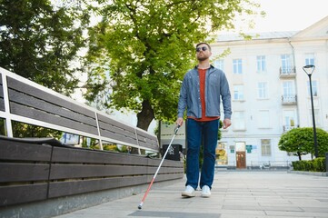 Close-up Of A Blind Man Standing With White Stick On Street