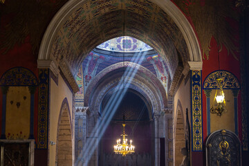 The sun rays shining into Armenian Cathedral in Lviv. Ukraine.