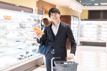Businessman buying vegetables at a supermarket