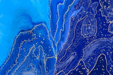 Lines and blue Alcohol ink fluid abstract art with gold glitter and liquid