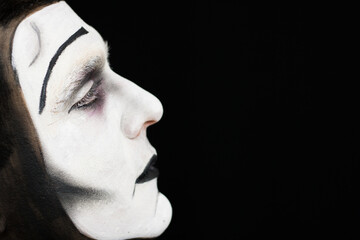 Side close-up portrait of old school male mime