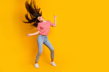 Fototapeta na wymiar Full body photo of excited energetic girl clubbing chilling dance isolated on yellow color background