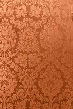Retro floral ornamental victorian wallpaper fabric in orange full frame repeating © Leoniek