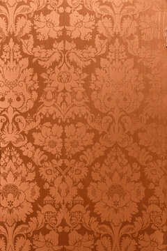 Retro floral ornamental victorian wallpaper fabric in orange full frame repeating