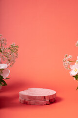 Natural minimal beauty wooden pedestal. Empty cosmetics podiums on pink background with flowers for product