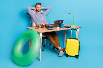 Full body photo of good mood travel agency worker have a break from work isolated on blue color background