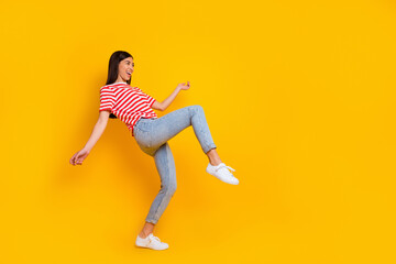 Fototapeta na wymiar Full body profile photo of satisfied cheerful person enjoy clubbing partying dance isolated on yellow color background