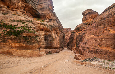 Al Siq Canyon in Petra, Jordan, orange red sandstone walls on both sides