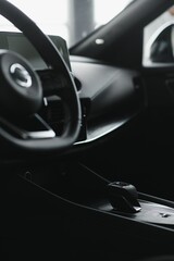 Obraz na płótnie Canvas car interior. Modern car speedometer and illuminated dashboard. Luxurious car instrument cluster. Close up shot of hybrid car instrument panel