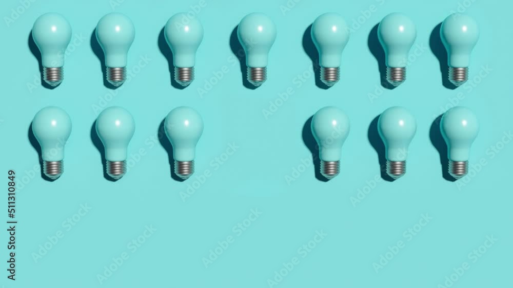 Poster outstanding orange color light bulb among blue light bulbs color sort group on blue background color