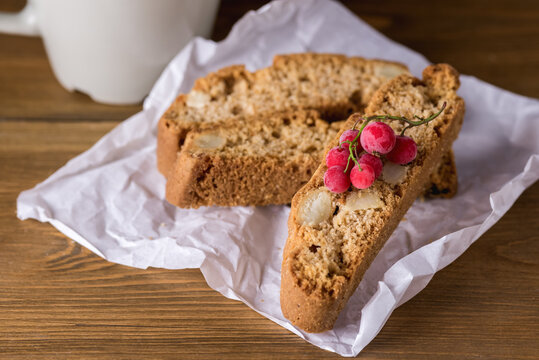 Homemade Gluten Free Biscotti or Cantuccini with Almonds Decorated with Red Currant Rustic Wooden Background Dessert