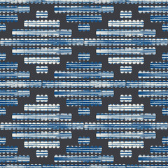 Ikat stitch effect vector seamless pattern. Hand drawn grunge textured needlework diamond shapes background. Color fade washed out blue white rhombus backdrop. Folk art style embroidery geo repeat.