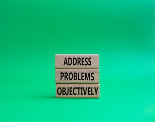 Address Problems Objectively symbol. Wooden blocks with words Address Problems Objectively. Beautiful green background. Business and Address Problems Objectively concept. Copy space.