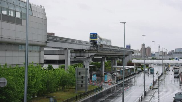 Osaka Monorail Departing from Atami Airport on Rainy Day in Japan 4k