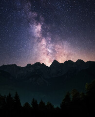 Fototapeta premium Milky Way above Vrsic mountain pass in Julian Alps in Slovenia