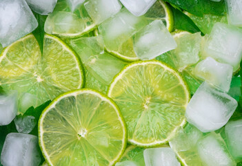 background of lime slices,mint leaves and cubes of ice ,concept of mojito , close-up, fresh summer...