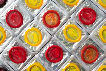 condoms in packaging. concept of contraception and prevention of sexually transmitted diseases,...