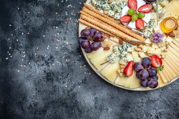 Antipasto platter, Antipasto Cheese board of various types of soft and hard cheese. spanish manchego cheese, aperitivo party concept, banner, menu, recipe place for text
