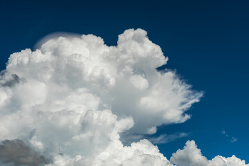 Naklejka na ściany i meble Closeup cumulus clouds with blue sky on high attitude