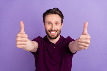 Photo of young cheerful guy show thumbs-up good perfect ideal select suggest rate isolated over...