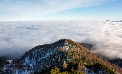 Sunset in the mountains with fog in the valley