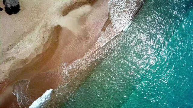 Static aerial view of the waves on the shore of a Westpunt beach, Curacao, Dutch Caribbean island